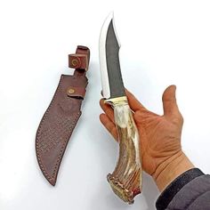 Beautiful crown stag handled knife, blade made of D2 steel. It's heavy duty knife to add in your survival gears. It's perfect knife for all outdoor activities, beautiful piece to add in your knife collections. We do accept custom order's feel to ask for your custom knife. All our knives are handmade, so it can be bit different from photos shown in listings.  Dimensions: Blade: D2 steel Handle: Crown Stag Antler Sheath: Cowhide leather sheath Overall length: 13 inches Blade length: 8 inches Handle length: 5 inches Blade thickness: 4mm  ADD ONS: Complimentary full-grain cowhide leather sheath Keen and precise re-sharpening prior to shipping Personalization available Easy to retrieve. Every knife has its unique pattern on the blade, it is handmade so it can be a little bit different from the Gifts For Men Anniversary, Men Christmas Gift, Husband Best Friend, Luxury Gifts For Men, Gift Luxury, Knife Gifts, D2 Steel, Bushcraft Knives, Hunting Gifts