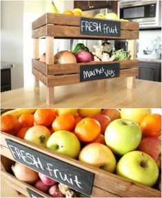 fresh fruits and vegetables displayed in wooden crates with chalk writing on the sides, below