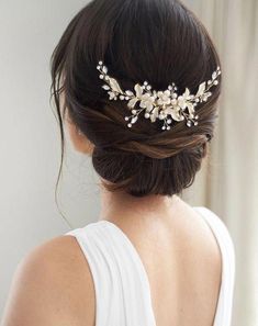 a woman wearing a bridal hair comb