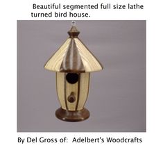 a bird house with the words beautiful segmented full size late turned bird house by del gross of adler's woodcrafts