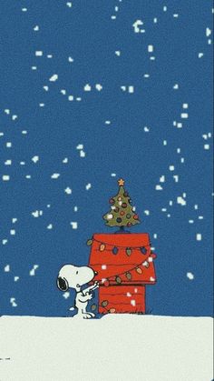 a charlie brown christmas card with a tree on top and a dog in the snow