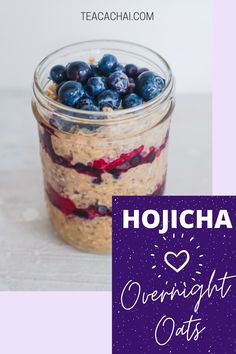 a jar filled with blueberries and oatmeal sitting on top of a table