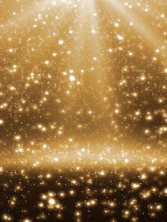 the light shines brightly on an abstract gold background with stars and sparkles in the foreground