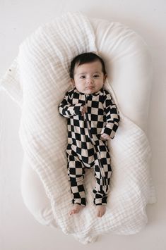 Made of the softest premium bamboo. Durable and well designed your little ones can sleep and play in these cozy pajamas. Our smallest sizes have rollover cuffs on the hands and all of the one piece sizes have cuffs on the feet giving you the option to go footless or footed without changing outfits. Sizes available in newborn - 24 months Material : 95% bamboo viscose / 5% spandexCare Instructions : Wash with like colorsTumble dry on low or hang dryExclusively available at Forever French Baby Checkered Pajamas, Playsuits Outfit, Baby Bamboo, French Baby, Baby Lounger, Custom Onesies, Bamboo Pajamas, Kids Gown, Cozy Pajamas