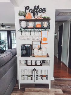 the coffee bar is decorated with pumpkins and other things to decorate on it's wall