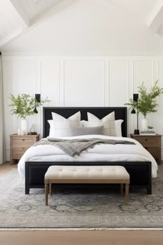 a large bed sitting in a bedroom on top of a rug