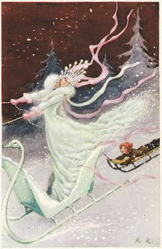 a woman riding on top of a sled next to a man in the snow