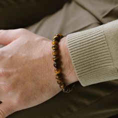 Return to the essentials. Essential for any contemporary man's jewelry assortment, these elastic stone bead bracelets are versatile enough to be worn individually or layered as preferred. - STONE: Tiger Eye (boosts confidence, aids harmony, enhances decision-making)- STONE SHAPE: Round- METAL COLOR: Brushed silver- METAL MATERIAL: 316L stainless steel- BRACELET TYPE: Elastic Stone Bead Bracelets, 99 Design, Gold Armband, Tiger Eye Bracelet, Tigers Eye Gemstone, Eye Bracelet, Black Edition, Bracelet For Men, Bead Bracelets