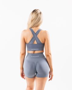 HIGHLIGHTS. Removable cups. Scrunch detailing in the center. Medium to high impact. Moisture-wicking, breathable fabric. Unbelievably soft texture. Knitted Alphalete core wordmark Seamless construction. Reinforced binding arm and neckline finishing FIT SUGGESTION. This item runs true to Alphalete's standard seamless fit.. If you are between sizes, we recommend sizing up.. Model is 5’7”/170cm, wearing a size XS with a 33.5”/85cm bust.. MATERIALS AND WASHING DIRECTIONS. 51% Polyamide, 38% Polyeste Gray Sportswear Activewear With Built-in Padding, Gray Sporty Activewear With Built-in Padding, Gray Nylon Athleisure Activewear, Functional Gray Activewear For Light Exercise, Gray Technical Activewear With Athletic Fit, Gray Fitted Seamless Sports Bra, Technical Activewear With Medium Support And Seamless Construction, Gray Nylon Activewear For Gym, Gray Nylon Activewear For Workout