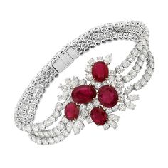 This bracelet features 28.05 carats of F-H VS-SI diamonds and 13.49 carats of moderately strong transparent red rubies. This bracelet features 1 pear brilliant, 13 marquise brilliant, and 163 round brilliant diamonds along with 5 rubies. Made in Italy. Viewings available in our NYC showroom by appointment. Luxury Red Bracelets For Anniversary, Royal Bracelets, Graff Diamonds, Expensive Diamond, Diamond Bangles, Diamond Bracelet Design, Bracelet Tennis, Ruby Bracelet, High Jewellery