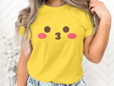 Express with Emoji: Yellow Shirt Collection 😀 Elevate your wardrobe with our emoji-inspired yellow shirts, adding a dash of fun and expression to your style. Why Choose Our Emoji Yellow Shirts? ✨ Support a Small Business: Your purchase directly supports our creative journey, helping us bring more cheerful designs to life. 😃 Express Yourself: Wear the iconic emoji face proudly and let your emotions shine through your fashion. 🌟 Premium Quality: Crafted with care, our shirts offer comfort and vibrant style, perfect for a pop of color. 🎁 Perfect Gift: Share the joy of expression with a friend, and gift them a shirt that's as bright as their smile. Join us in celebrating the art of expression. Shop now and add a touch of cheerfulness to your attire! 𝐏𝐑𝐎𝐂𝐄𝐒𝐒𝐈𝐍𝐆 𝐓𝐈𝐌𝐄 𝗔𝗡𝗗 𝐒? Trendy Yellow Tops With Cartoon Print, Trendy Yellow Tops With Character Print, Playful Yellow Top With Cartoon Print, Yellow Short Sleeve Top With Character Print, Funny Yellow Tops With Letter Print, Funny Yellow Top With Letter Print, Funny Yellow Graphic Print Top, Cute Yellow Tops With Character Print, Cute Yellow Top With Character Print