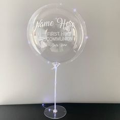 a clear glass award with the name of someone's first home community on it