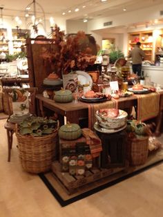 a display in a store filled with lots of different types of dishes and food items