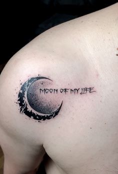 a man with a tattoo on his shoulder that reads moon of my life and the word