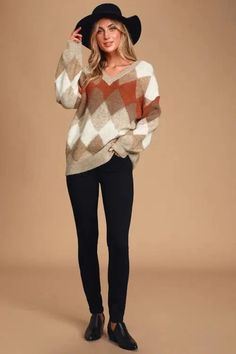 This Anna Argyle Oversized V-Neck Sweater is perfect for those who want to feel feminine and comfortable at the same time. The oversized, diamond-print argyle pattern is soft and flattering, while the modest V-neck keeps you looking professional and put together. Everyone knows smart is sexy, and nothing says "smart" like an argyle sweater. Oversized Diamond-print argyle pattern Multi-colored: Coral, Taupe, and Cream V-neck Material: 70% Acrylic, 25% Polyester, 5% Nylon Oversized Pullover Sweaters, Balloon Sleeve Sweater, Argyle Print, Book Smart, Argyle Pattern, Sweater Oversized, Form Fitting Dress, Argyle Sweater, Oversized Pullover