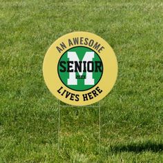 a yellow and green sign that says an awesome senior live's here on it