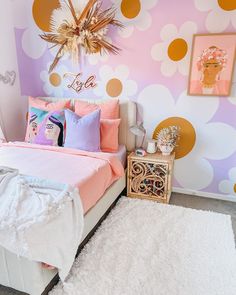 a bedroom decorated in pastel colors with polka dot wallpaper and white fluffy rugs