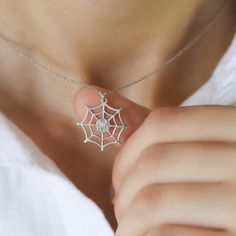 This Silver Spiderweb Necklace (Silver Spiderweb Necklace, Dainty Funky Silk Spider Pendant, Cobweb Halloween Costume Accessory, Trick or Treat Jewelry Gifts for Her Kids) is a perfect gift. Our jewelry are water and tarnish-resistant, nickel-free, and available 14K Gold plating on 925 Sterling Silver. They make a great gift for special events and days (e.g. birthdays, anniversaries, holidays). Materials: 925K Sterling Silver Style: Minimalist  Charm Size WXH: 20x20mm Chain style: Cable Chain le Themed Silver Necklaces For Halloween, Personalized Silver Necklace For Halloween, Silver Themed Necklace For Halloween, Spiderweb Jewelry, Halloween Themed Silver Necklaces, Silver Themed Halloween Necklace, Spider Necklace Aesthetic, Spider Choker Necklace, Spider Web Chain Necklace