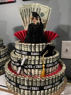 a graduation cake made out of stacks of money