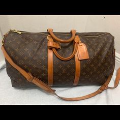 Louis Vuitton Keepall Bandouliere Bag Monogram Canvas 55 Good Condition No Major Flaws 22"W X 12.5"H X 9.5"D 4.5" Handle Drop 18-22" Strap Drop No Keys No Lock Luxury Monogram Canvas Bags With Leather Handles, Designer Monogram Canvas Duffle Bag, Designer Duffle Bag For Shopping, Luxury Monogram Canvas Duffle Bag, Designer Travel Bag With Gold-tone Hardware, Luxury Monogram Canvas Duffle Bag For Travel, Luxury Brown Duffle Bag With Detachable Strap, Classic Monogram Canvas Duffle Bag, Brown Monogram Canvas Duffle Bag