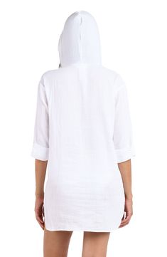 With all the same cozy comfort of your favorite hoodie, this swimsuit cover-up is perfect for throwing on post dip (or after the sun sets). The open neck sans drawstring makes for easy ons and offs and a longer length in back provides all the coverage you need. A kangaroo pocket keep your hands warm but can also hold small items like keys or sunscreen. [split] Details Hooded tunic Open neck Kangaroo pocket Longer length in back Fabric 100% Cotton Spring Poolside Cover-up With Drawstring, Relaxed Fit Long Sleeve Top For Beach Cover-up, Oversized White Cover-up For Loungewear, Relaxed Fit Long Sleeve Cover-up For Vacation, Relaxed Fit Summer Loungewear Cover-up, Oversized Cotton Casual Cover-up, Relaxed Long Sleeve Tops For Summer, Oversized Casual Cover-up For Vacation, Summer Vacation Cotton Hoodie