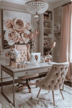 a desk with a chair, chandelier and flowers on it