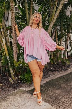 - Keep it simple and cute with this flowy top! - Unlined material with crochet accents - A round neckline - Loose ¾ length sleeves with elastic cuffs - A flowy babydoll silhouette that ends in a straight hemline Measurements 1XL : Bust 66", Hip 62", Length 26", Sleeve Length 14", Waist 64". 2XL : Bust 68", Hip 64", Length 26.5", Sleeve Length 14", Waist 66". 3XL : Bust 70", Hip 66", Length 27.5", Sleeve Length 14.5", Waist 68". Pink Peasant Top For Summer Vacation, Pink Peasant Top For Spring Vacation, Pink Bohemian Peasant Top For Beach, Pink Balloon Sleeve Tops For Day Out, Feminine Flowy Peasant Top For Beach, Pink Half Sleeve Blouse For Summer, Pink Half Sleeve Summer Blouse, Pink Summer Peasant Top For Day Out, Bohemian Balloon Sleeve Tops For Beach