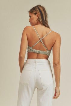 Final Sale - Get it before it's gone! Date nights call for the Meghan Sage Satin Cowl Neck Crop Top! Sage satin fabric shapes this cite crop top with open back. Features a scrunched cowl neck (with padded pushup bra inserts) and a cross back detailing. Style with high-waisted jeans for cute date night look! DETAILS & CARE Polyester/Spandex. Hand wash cold. Imported. Fitted Crop Top With Bra Friendly Strappy Back, Fitted Strappy Back Crop Top, Fitted Ruched Bandeau Crop Top, Summer Crop Top With Strappy Back And Bra-friendly Design, Fitted Strappy Back Top With Bra-friendly Design, Summer Crop Top With Strappy Back And Bra Friendly, Summer Crop Top With Strappy Back And Bra Support, Fitted Tie Back Crop Top With Cross Back, Spring Seamless Backless Crop Top