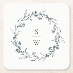 a monogrammed coaster with the letter w in a wreath