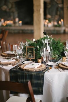 the table is set with place settings for dinner