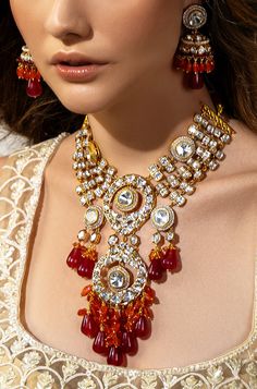 Multi Coloured Polki Bridal Necklace Set - Joules By Radhika Radiate romance with our 22Kt Gold Plated necklace set, a perfect match for brides on their wedding day. The enchanting Hydro Polkis, complemented by alluring red Agate drops and vibrant carnelian beads, create a captivating ensemble. Embrace the elegance and charm of this exquisite set, adding a touch of sophistication to your bridal allure. SET INCLUDES: Necklace and Earrings Details: Handcrafted with ❤️ Metal: Brass Product Type: Ne Fusion Style Kundan Jewelry Sets For Wedding, Hand Set Chandbali Bridal Necklace For Wedding, Fusion Style Temple Necklace With Tilla For Wedding, Hand Set Necklace For Wedding And Festive Occasions, Hand Set Necklaces For Wedding And Festive Occasions, Festive Fusion Wedding Jewelry Sets, Festive Handcrafted Necklace For Wedding, Gold Fusion Chandbali Bridal Necklace, Gold Fusion Style Bridal Necklace With Cutdana