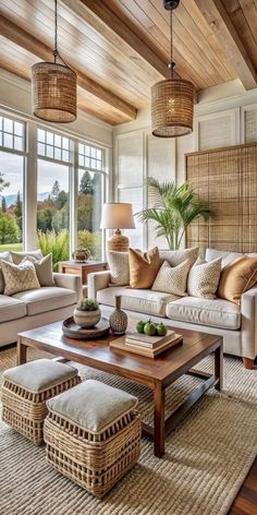 a living room filled with furniture and lots of windows