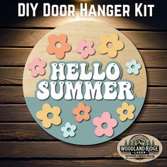 the diy door hanger kit has flowers on it and says, hello summer