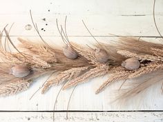 some dry grass on a white wooden surface