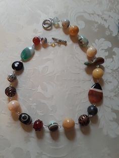 A beautiful assorted gemstone necklace chain linked. Assorted beads are sandstone, carnelian, onyx, jasper, turquoise and other assorted beads. These beautiful beads measure from.12mmm to 18mm.the flat beads measure 35mm by 24mm. A great look for any occasion. Boho Jewlery, Flat Beads, Dangle Bracelet, Toggle Bracelet, Beaded Dangles, Necklace Chain, Austin Tx, Beautiful Bracelet, Gemstone Necklace