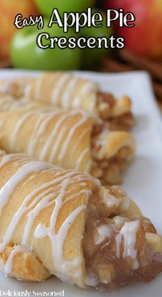 two apple pie crescents on a white plate with apples in the background and text overlay that reads easy apple pie crescents