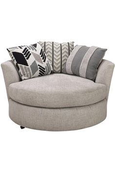 a round couch with several pillows on it and a pillow in the middle, sitting against a white background