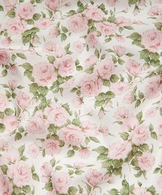 a pink rose print fabric with green leaves and flowers on white background, closeup