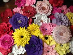 a bunch of flowers that are sitting on a table