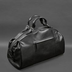 A leather travel bag is a comfortable and roomy model that will allow you to take everything you need with you on a business trip or a short trip. Key Features: The bag is made of smooth genuine leather of premium quality. Strong textile lining inside. The accessory closes with a zipper, which is fixed with whips. The bag has one roomy compartment and several pockets for small items. The bag has comfortable leather handles. The set includes a removable wide shoulder strap. The bottom is protecte Luxury Satchel Briefcase For Travel, Elegant Soft Leather Travel Bag For On-the-go, Luxury Travel Satchel Briefcase, Elegant Leather Bag For Trips, Business Trip Tote Satchel With Luggage Sleeve, Business Trip Satchel With Luggage Sleeve, Leather Tote Briefcase For Travel, Leather Briefcase For Travel, Business Trip Satchel Luggage With Leather Handles