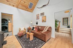 a living room filled with furniture and a flat screen tv