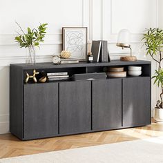 This sideboard pairs a sleek, minimal design with plenty of rustic styles for a modern look. Grab it for your living room, dining room, or anywhere that needs a storage boost. A plinth-style base supports this clean-lined piece to create a simple silhouette. Made from engineered wood, this sideboard's frame has a weathered finish that complements any lodge-worthy space. Four cabinet doors open to reveal room for dishes, glasses, and media items. On top, open shelves are handy for books and cups. Shelves For Kitchen, Nursery Furniture Sets, Simple Silhouette, Cabinet Storage, Buffet Cabinet, Blue Living Room, Cabinets For Sale, Sideboard Furniture, Open Shelves