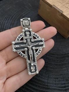 Silver Orthodox cross with onyx Art. 0162 ✔️Silver 925 with blackening. ✔️Black onyx and black zirconium ✔️ Weight 31 grams ✔️Size 60/35mm ✔️The cross depicts: 🔘 George the Victorious 🔘 Nicholas the Wonderworker 🔘 Panteleimon the Healer 🔘 Virgin Mary 🔘 Holy Matrona 🔘 Archangel Michael ✔️Possible production in: 🟡Gold 14K or 18K (red, yellow, white) 🌕24K gold plated sterling silver 🔘Silver with blackening or rhodium (shown in photo) Need more information? If you have any questions please Black Sterling Silver Crucifix Jewelry, Luxury Silver Sterling Silver Cross Necklace, Luxury Sterling Silver Cross Necklace In Silver, Spiritual Black Sterling Silver Cross Necklace, Black Engraved Pendant Cross Necklace, Black Sterling Silver Cross Necklace For Gift, Black Engraved Cross Jewelry, Handmade Black Crucifix Necklace, Black Engraved Cross Necklace Gift