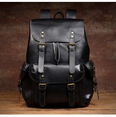 With genuine leather and vintage appearance,this backpack will never go out of style.This backpack is made using high-quality materials and elaborate craftsmanship.It has multipurpose design and is the perfect gift for your friends.  This leather backpack mens gender-neutral and very classy-looking. You can use it for your college, travel or business, People will go crazy about this bag everywhere you go. 
 
The large capacity design makes this vintage backpack can meet the needs of daily life and work. It can securely protect your 16 inch computer, more pockets design allows you to easily carry your wallet, cell phone, sunglasses and other items. 
 
     ITEM FEATURES  - 1 x Main Compartment 
- 1 x Laptop Compartment 
- 1 x Front Pocket 
- 1 x Interior Zipper Pocket 
- 2 x Slot Pockets 
- Vintage Black Satchel Backpack, Black Vintage Satchel Backpack, Vintage Leather Travel Backpack, Classic Leather Backpack For Outdoor, Vintage Black Backpack For Travel, Vintage Black Leather Backpack For Daily Use, Black Vintage Leather Backpack For Daily Use, Vintage Black Leather Backpack, Vintage Leather Backpack With Large Capacity