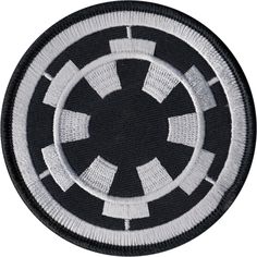 a circular black and white patch with an abstract design