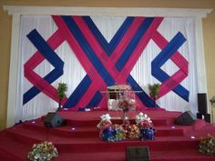 the stage is decorated with red, white and blue ribbons on it's sides