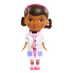 the doll is wearing a white lab coat and pink shoes with her hair in pigtails