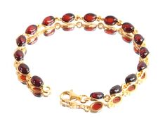 Beautifully Cherry warm Amber Gemstones on links of Gold Plated 925 Sterling Silver. A quality classic gift for a lady or for keeps.  This Quality Amber Gem will delight as a gift for mum. Each piece is unique and a one off here at Amber SOS.  A high impact piece. The styling and originality of this bangle would make it an ideal gift.  Amber size approx.  6mm X 5mm.  16 pieces. Length: 19cm / 7.5inch Weight:  ~7.5g Shape:  Oval. Gold plated marked Silver 925. Exclusive Quality. >WHY BUY FROM US< Luxury Amber Gemstones For Gift, Luxury Classic Cabochons As Gifts, Luxury Amber Beaded Bracelets As Gift, For Keeps, Silver Link Bracelet, Amber Gemstone, Amber Jewelry, Unisex Gifts, Gemstone Bracelets