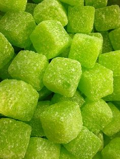 green candy cubes sitting on top of each other