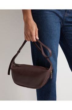 Introducing the perfect day-to-night crossbody—this versatile sling bag comes in smooth leather and has an adjustable strap (aka it can be worn multiple ways). The interior has plenty of room to hold your wallet, keys and other essentials (there's even an interior slip pocket for easy access to your phone). Top zip closure Adjustable crossbody strap Exterior zip pocket Interior wall pocket Lined Leather Imported Crossbody Purse Outfit, Madewell Crossbody Bag, Leather Sling Bags Women, Brown Sling Bag, Leather Sling Bags, Sling Bags Women, Sling Crossbody Bag, Cross Body Sling Bag, Purse Outfit